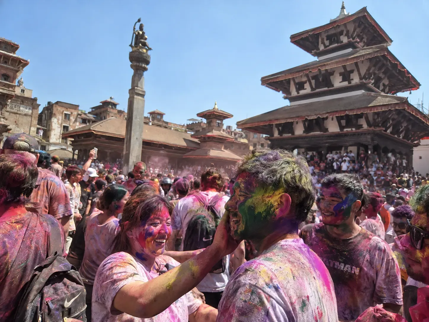 People celebrating Holi with colorful powder in Kathmandu, Nepal